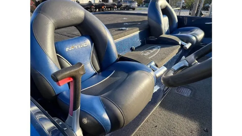 Slide: The Image of 2014 Nitro Z-8 boat interior with blue and black seats. - 8