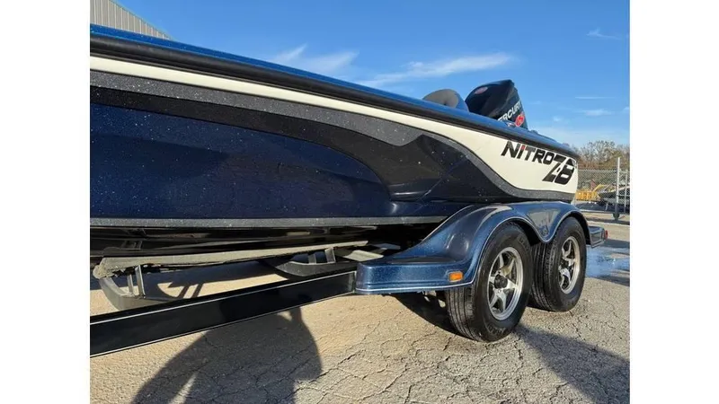 Slide: The Image of 2014 Nitro Z-8 boat on trailer, side view, sunny day. - 9