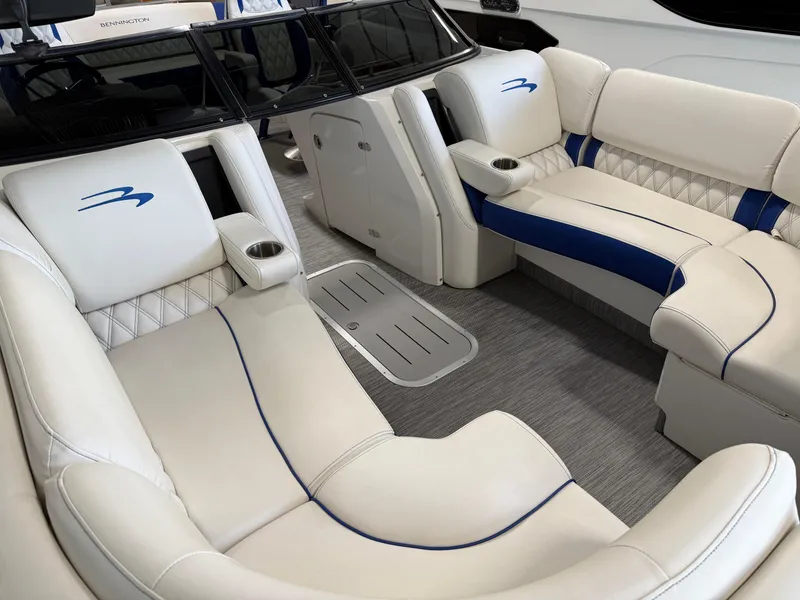 Slide: The Image of Luxurious interior of 2021 Bennington QX25 boat with white and blue seating. - 18