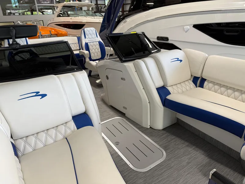 Slide: The Image of Luxurious interior of a 2021 Bennington QX25 boat with plush seating and modern design. - 20