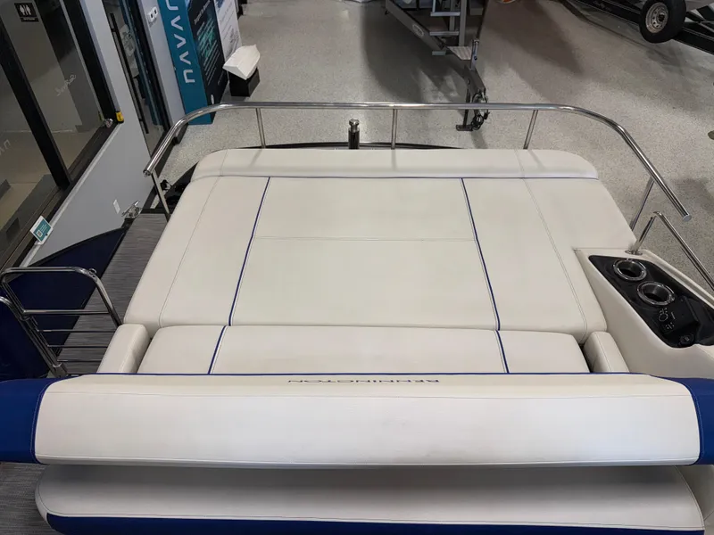 Slide: The Image of 2021 Bennington QX25 boat with white cushioned seating and stainless steel railing. - 26