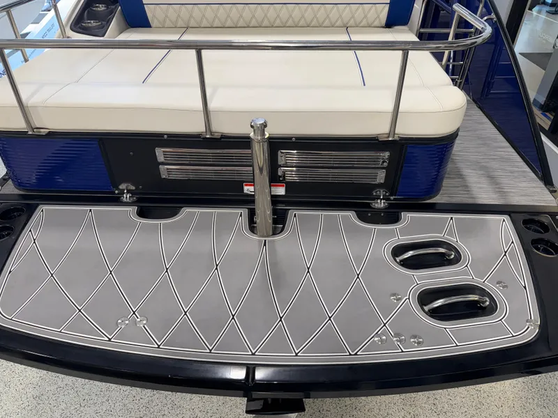 Slide: The Image of 2021 Bennington QX25 boat with sleek deck design and comfortable seating. - 28