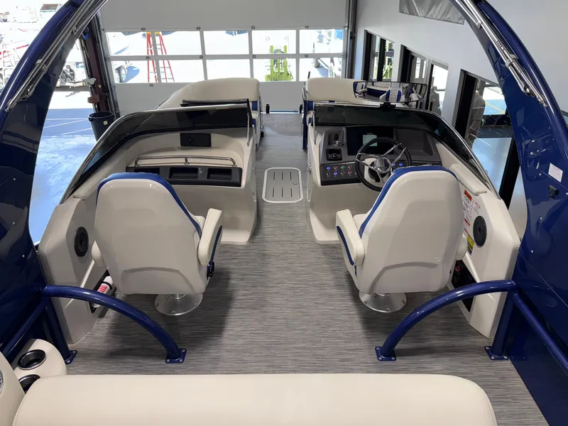 Slide: The Image of 2021 Bennington QX25 boat interior with modern seating and control panel. - 32