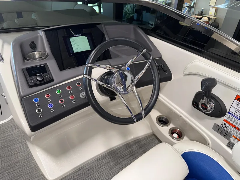 Slide: The Image of 2021 Bennington QX25 boat dashboard with steering wheel and control panel. - 35