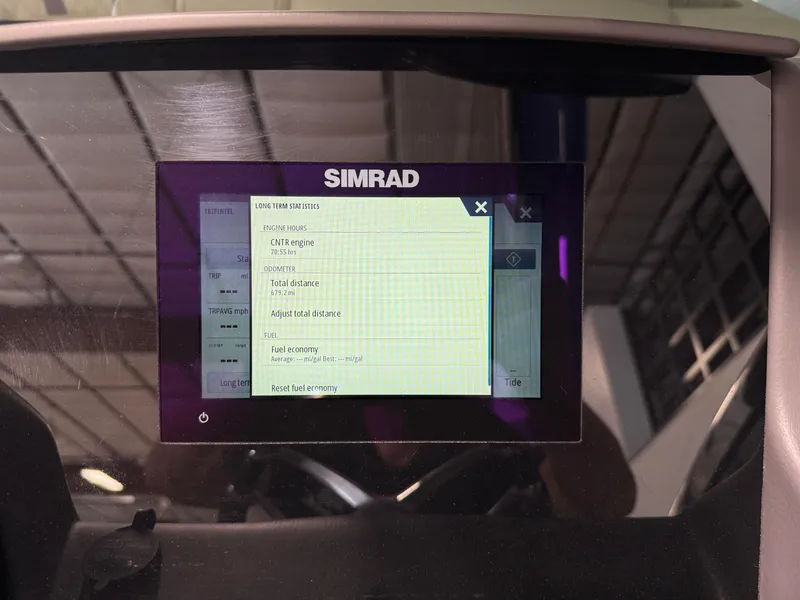 Slide: The Image of Simrad display screen on 2021 Bennington QX25 boat, showing navigation and trip data. - 36