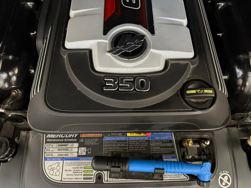 Slide: The Image of Engine of a 2021 Bennington QX25 boat, featuring a 350 horsepower Mercury motor. - 46