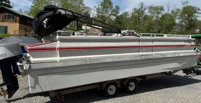 Slide: The Image of 1988 Skipper Craft 240 boat on trailer, white with red stripe, parked outdoors. - 3