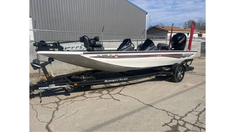 Slide: The Image of 2018 Ranger RT198P fishing boat on trailer, parked outdoors. - 3