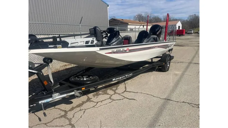 Slide: The Image of 2018 Ranger RT198P fishing boat on trailer, parked outdoors. - 4