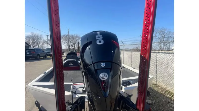 Slide: The Image of 2018 Ranger RT198P boat with powerful outboard motor, parked outdoors. - 8