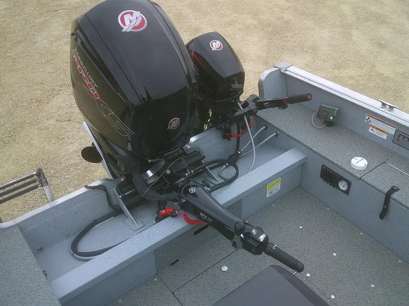 Slide: The Image of 2019 Lund 2000 Alaskan Tiller boat with dual outboard motors, interior view. - 14