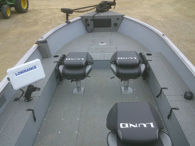 Slide: The Image of 2019 Lund 2000 Alaskan Tiller boat interior with Lowrance equipment and seating. - 3