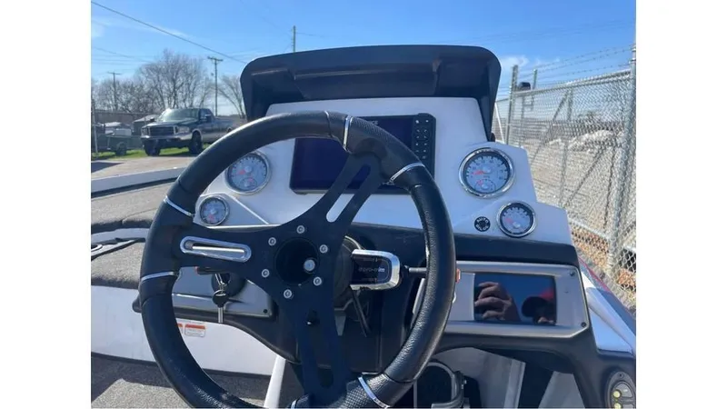 Slide: The Image of 2020 Nitro Z21 boat dashboard with steering wheel and gauges in sunlight. - 11