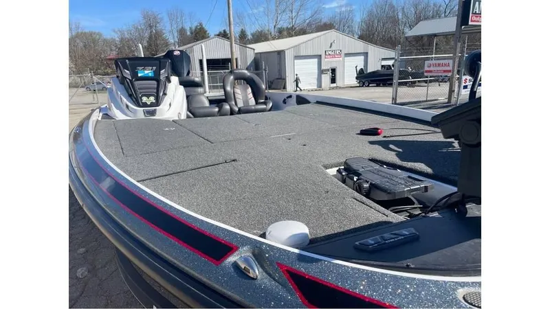 Slide: The Image of 2020 Nitro Z21 boat with spacious deck, parked outdoors near buildings. - 12