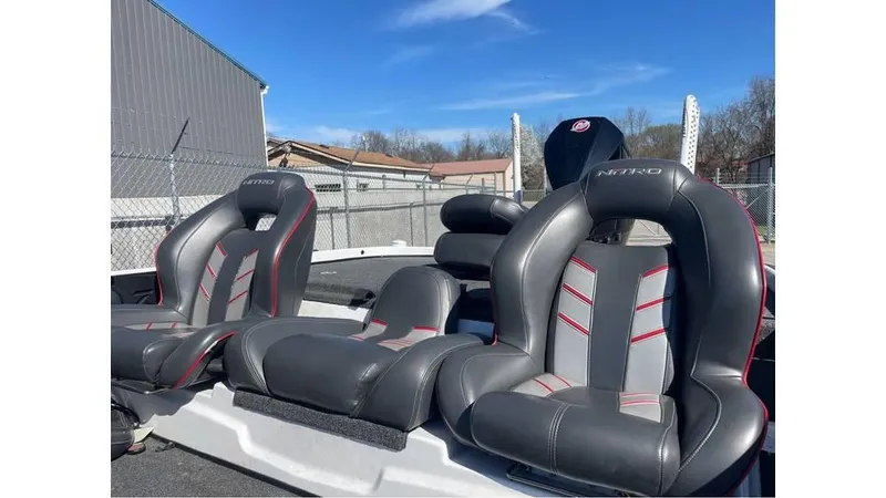 Slide: The Image of 2020 Nitro Z21 boat seats with sleek black and red design. - 4