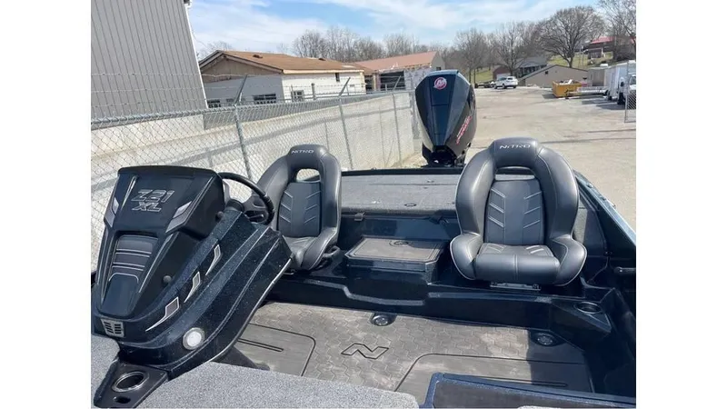 Slide: The Image of 2022 Nitro Z21 XL boat interior with dual seats and steering console. - 6