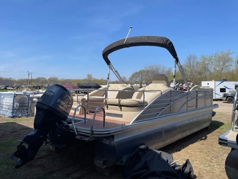 Slide: The Image of 2013 Bennington 2275 RCW pontoon boat with Yamaha outboard motor, parked on grass. - 4