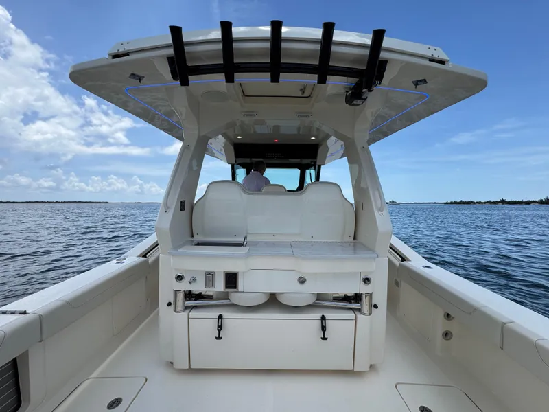 Slide: The Image of 2025 Scout 425 LXF boat interior with seating and ocean view. - 26
