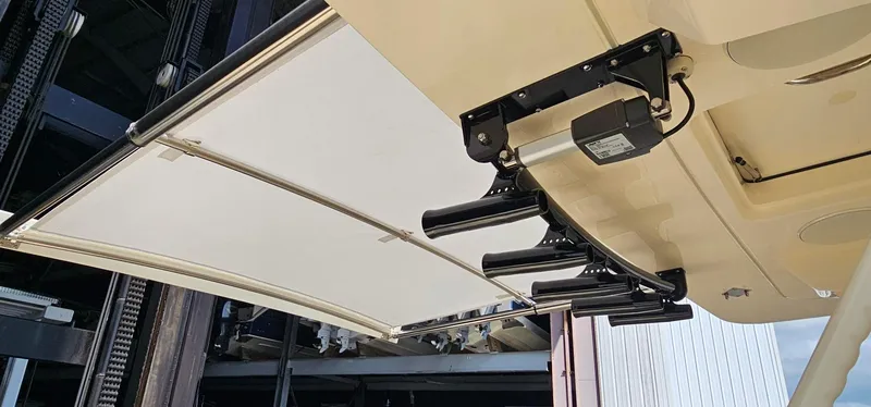 Slide: The Image of 2025 Scout 425 LXF boat with retractable ladder and canopy mechanism. - 28