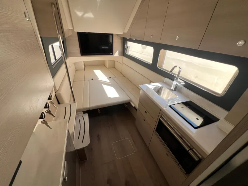 Slide: The Image of Luxurious interior of 2025 Scout 425 LXF yacht with modern kitchen and seating area. - 35