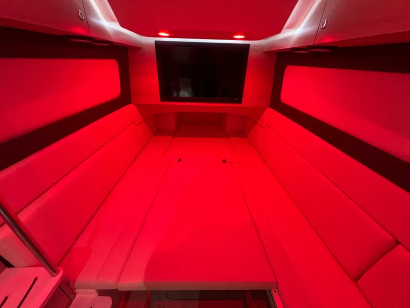 Slide: The Image of Luxurious red-lit interior cabin of 2025 Scout 425 LXF boat. - 37
