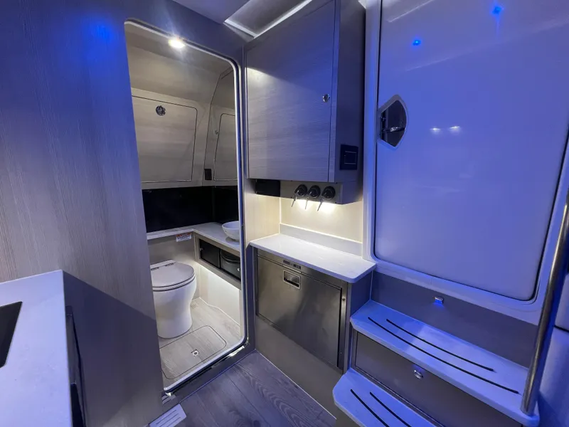 Slide: The Image of Luxurious interior of 2025 Scout 425 LXF boat with modern amenities and sleek design. - 40