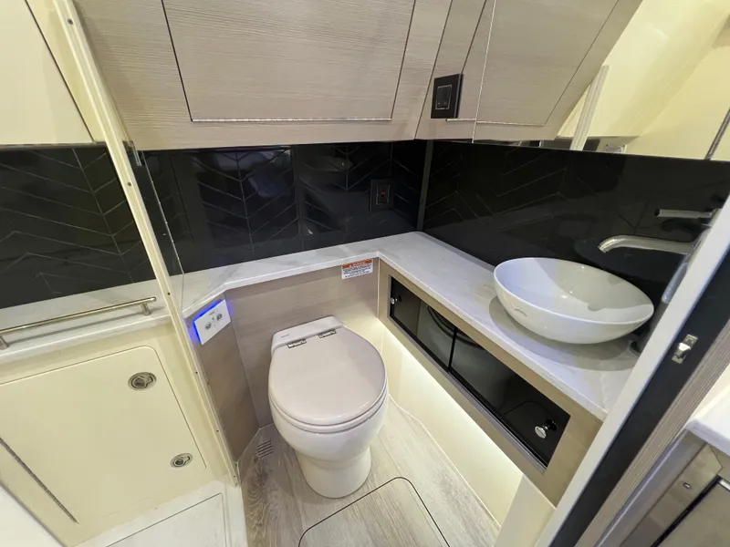Slide: The Image of Luxurious bathroom in 2025 Scout 425 LXF boat with modern fixtures and sleek design. - 41