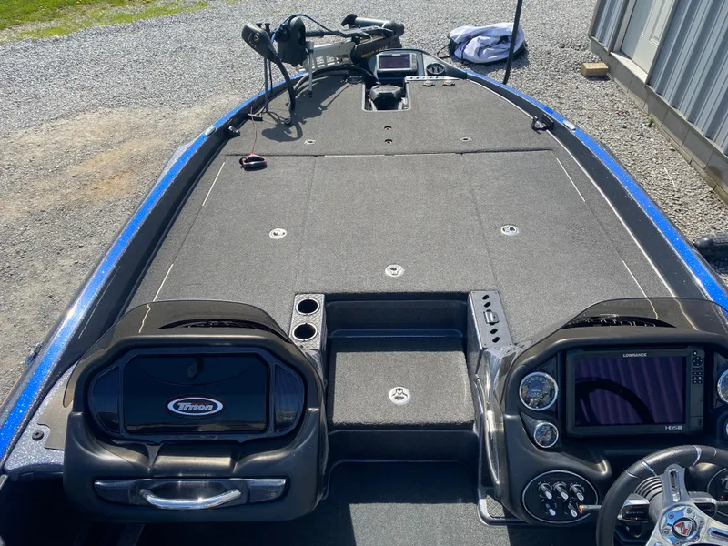 Slide: The Image of 2019 Triton 20 TRX Patriot boat interior with dual consoles and advanced navigation systems. - 13