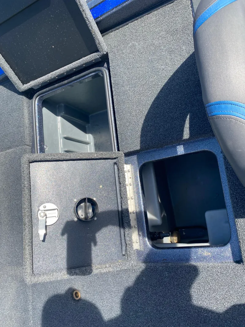 Slide: The Image of 2019 Triton 20 TRX Patriot boat interior storage compartments and seating detail. - 16