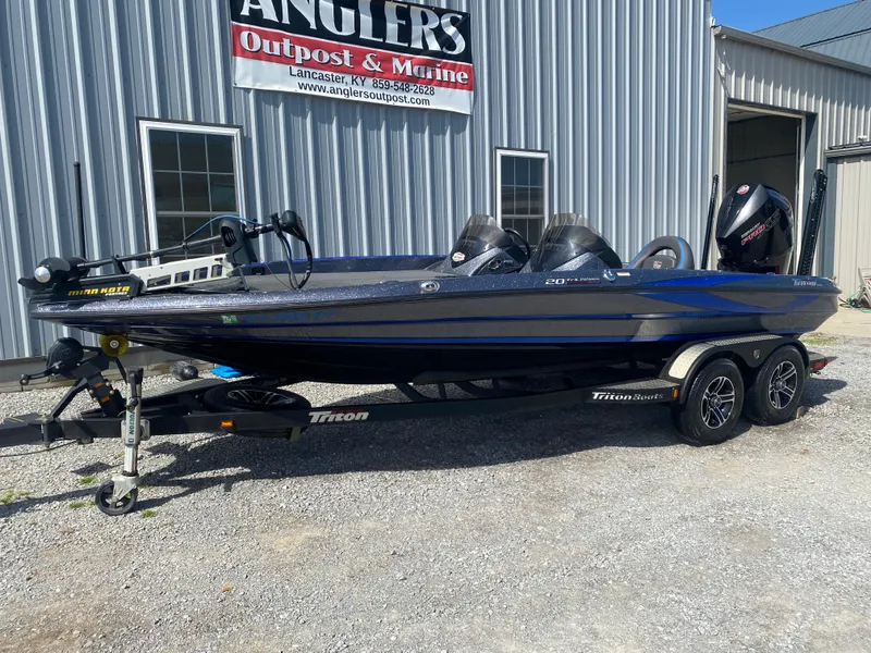 Slide: The Image of 2019 Triton 20 TRX Patriot boat parked outside Angler's Outpost & Marine. - 3