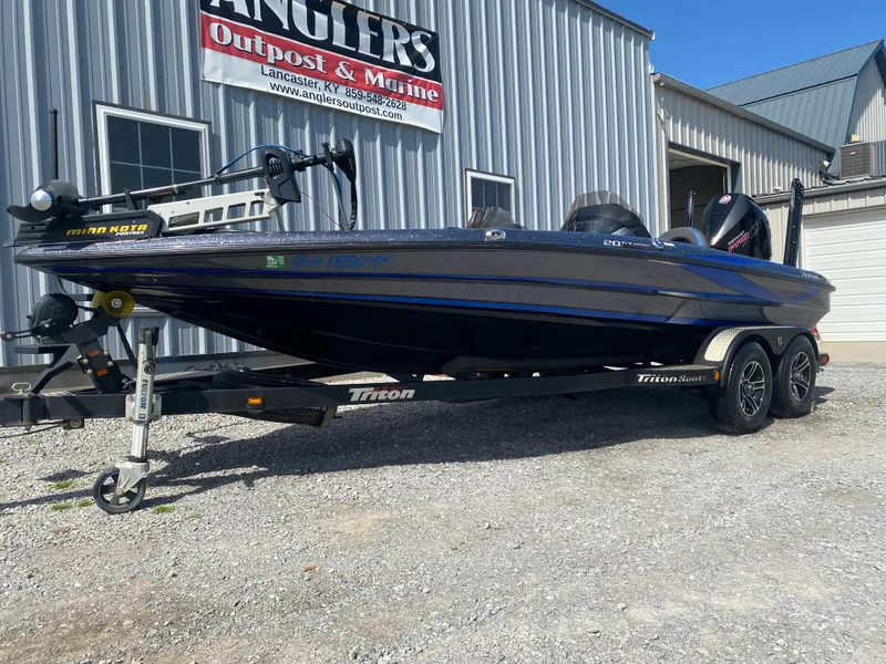 Slide: The Image of 2019 Triton 20 TRX Patriot boat on trailer outside Anglers Outpost & Marine. - 4
