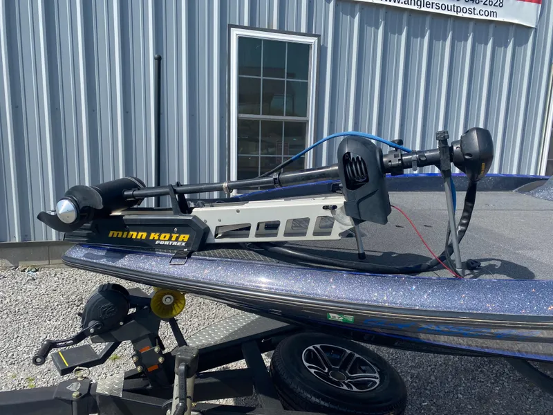 Slide: The Image of 2019 Triton 20 TRX Patriot boat with Minn Kota trolling motor on trailer. - 5