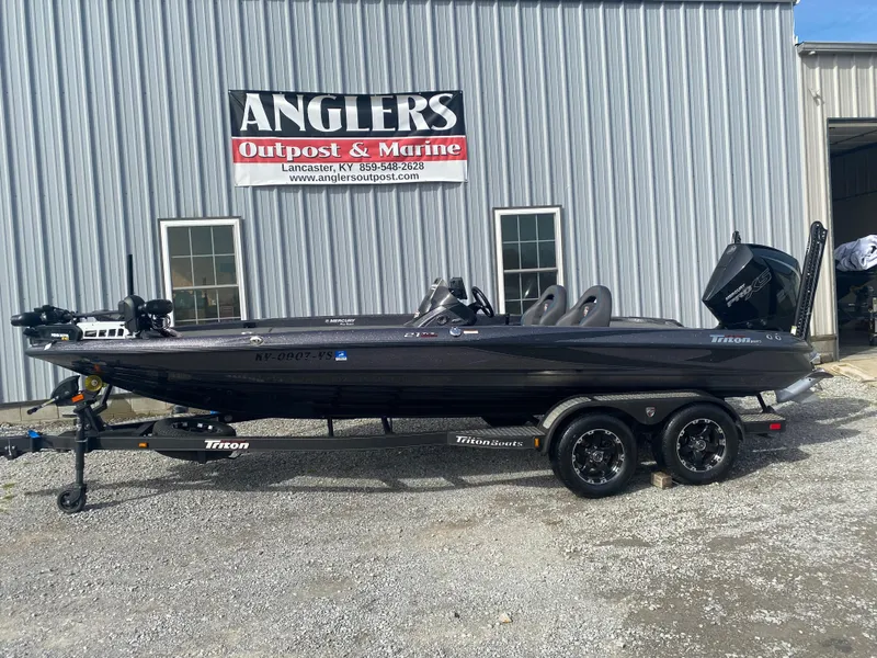 Slide: The Image of 2020 Triton 21 TrX boat parked outside Angler's Outpost & Marine. - 1
