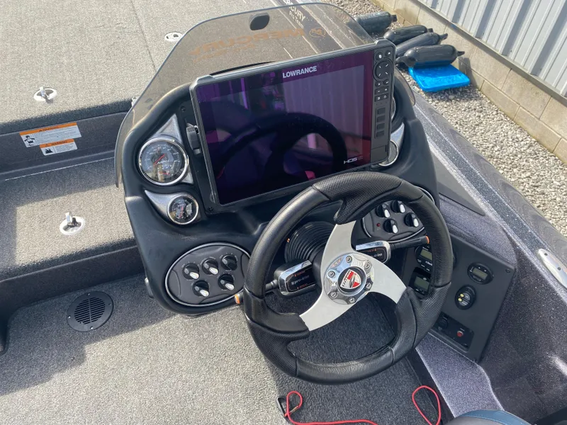 Slide: The Image of Steering console of 2020 Triton 21 TrX boat with Lowrance display and gauges. - 11