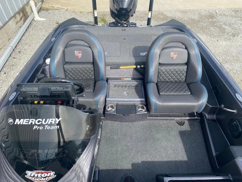 Slide: The Image of 2020 Triton 21 TrX boat interior with dual seats and Mercury Pro Team branding. - 17
