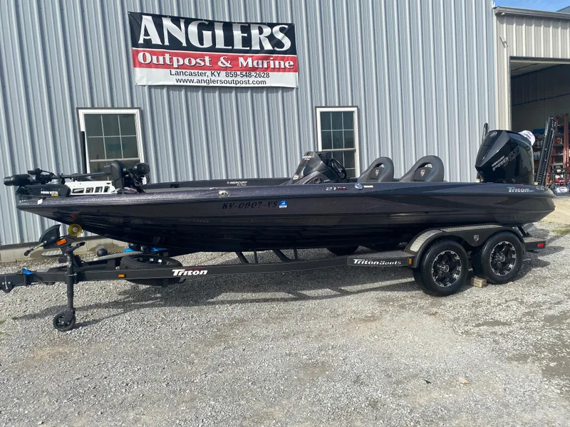 Slide: The Image of 2020 Triton 21 TrX boat on trailer at Anglers Outpost & Marine dealership. - 2