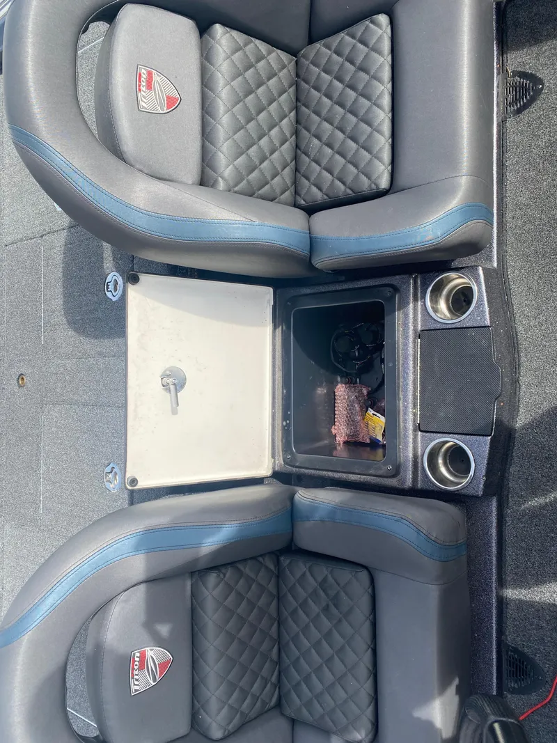Slide: The Image of 2020 Triton 21 TrX boat interior with quilted seats and center console. - 23