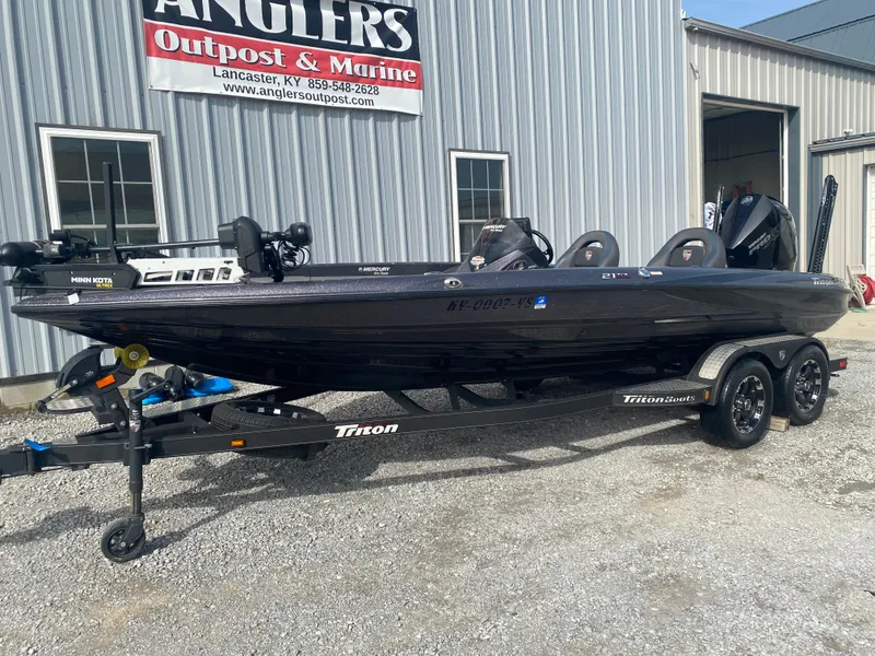 Slide: The Image of 2020 Triton 21 TrX boat on trailer at Angler's Outpost & Marine dealership. - 3