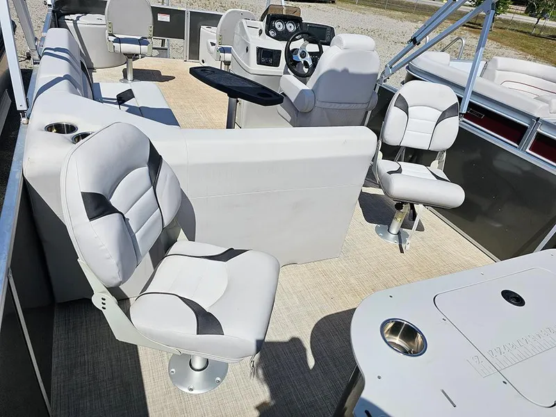 Slide: The Image of 2023 SunCatcher Select 320 F pontoon boat interior with plush seating and modern helm. - 10
