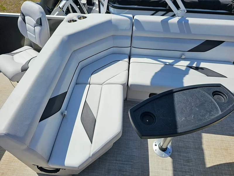 Slide: The Image of Luxurious seating area on 2023 SunCatcher Select 320 F pontoon boat with table. - 11