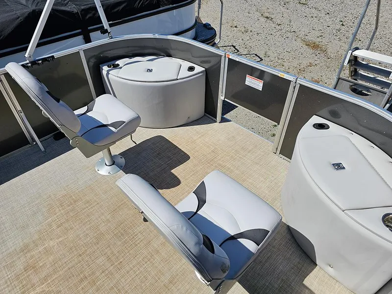 Slide: The Image of 2023 SunCatcher Select 320 F boat interior with seating and storage compartments. - 17