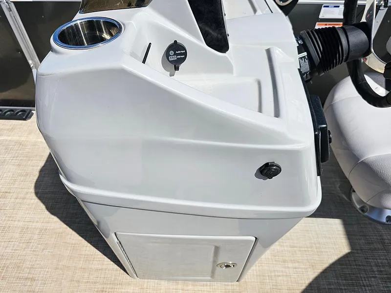 Slide: The Image of 2023 SunCatcher Select 320 F boat console with cup holder and control panel. - 21
