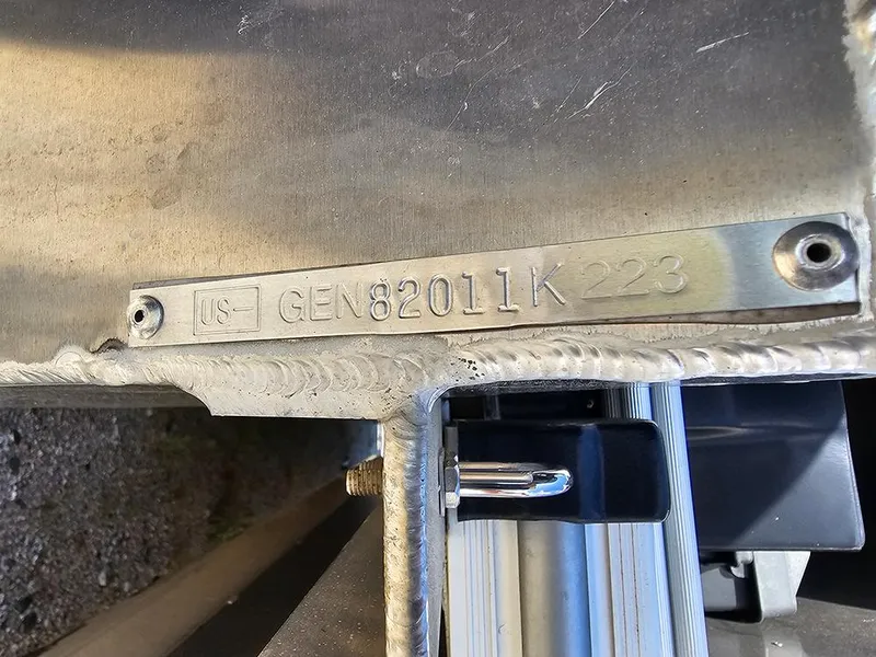Slide: The Image of Metallic identification plate on a 2023 SunCatcher Select 320 F boat. - 22