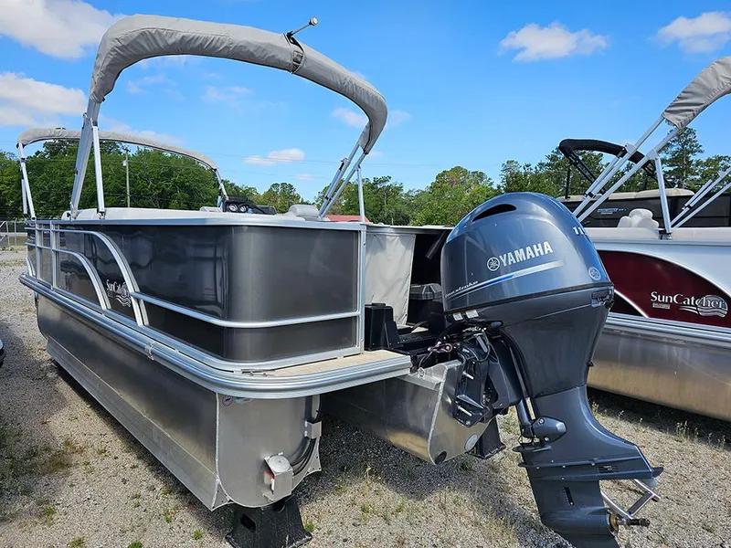 Slide: The Image of 2023 SunCatcher Select 320 F pontoon boat with Yamaha outboard motor, docked outdoors. - 5