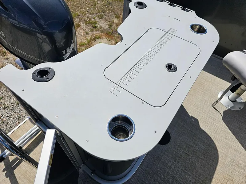 Slide: The Image of 2023 SunCatcher Select 320 F boat deck with integrated cup holders and measuring board. - 8