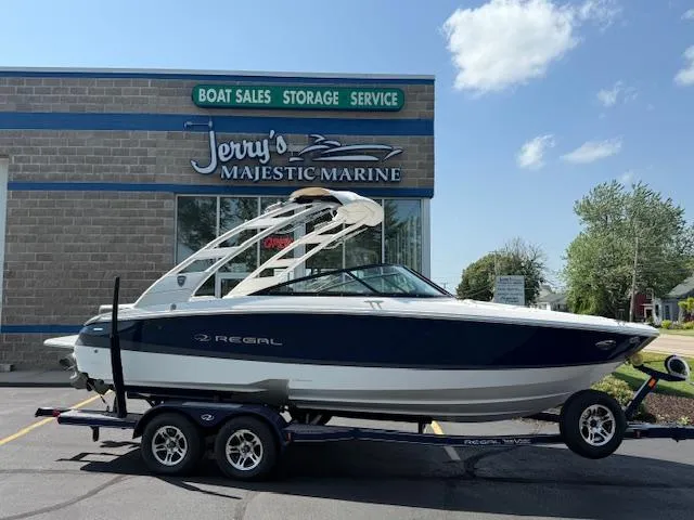 Slide: The Image of 2025 Regal LS2 boat on trailer at Jerry's Majestic Marine dealership. - 1