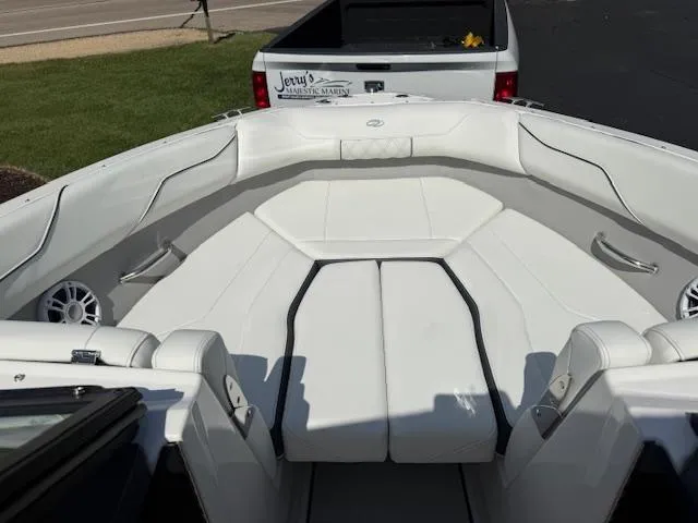 Slide: The Image of 2025 Regal LS2 boat interior with white seating and sleek design. - 12