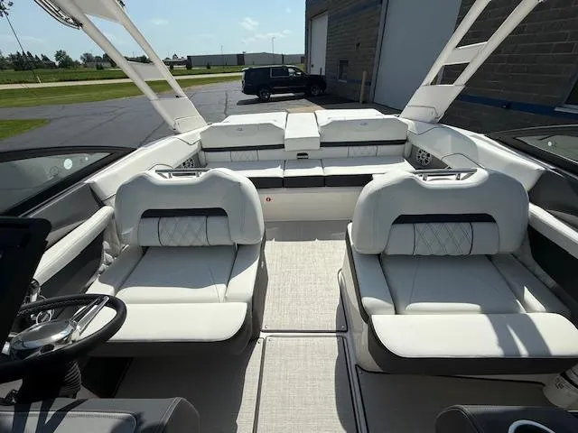Slide: The Image of 2025 Regal LS2 boat interior with white seating and modern design. - 18