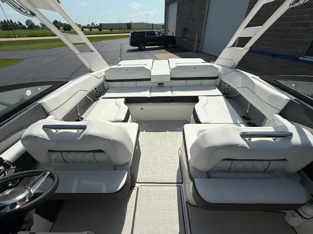 Slide: The Image of 2025 Regal LS2 boat interior with white seating and modern design. - 19