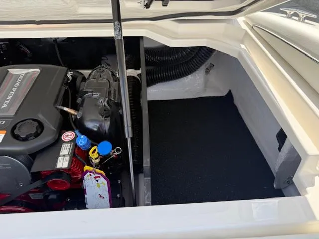 Slide: The Image of 2025 Regal LS2 boat engine compartment with Volvo Penta engine, showcasing clean design and components. - 23